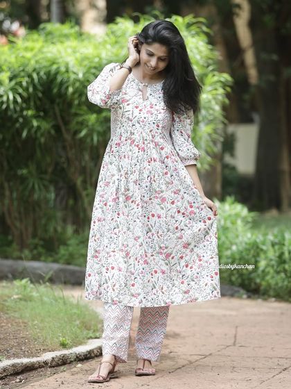 Shining bright in white for Navratri. This delicate floral printed kurta pant set in pure cotton embraces the spirit of purity and devotion.