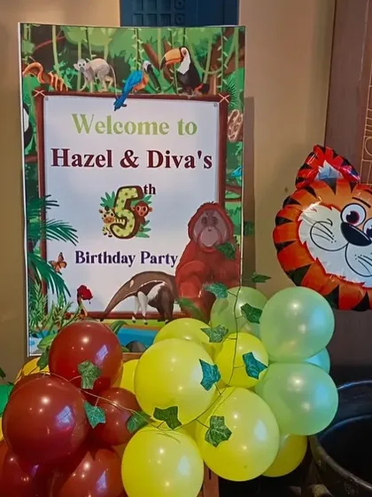 A personalized welcome sign for Hazel & Diva's 5th jungle-themed birthday party.
