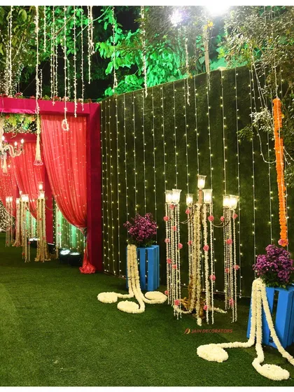 A beautiful detail of the wedding walkway, with fairy lights and floral garlands creating a magical ambiance. Every part of the journey is designed to be beautiful.