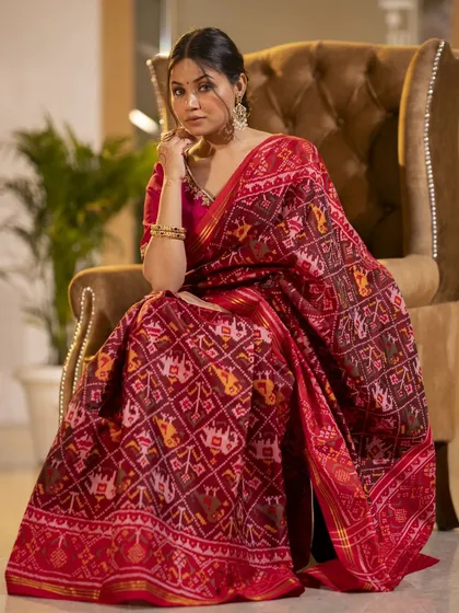 Capturing the elegance of traditional Indian attire requires a focus on detail and grace. This shot highlights the rich texture and intricate patterns of the saree, set in a luxurious indoor environment to convey a sense of timeless sophistication.
