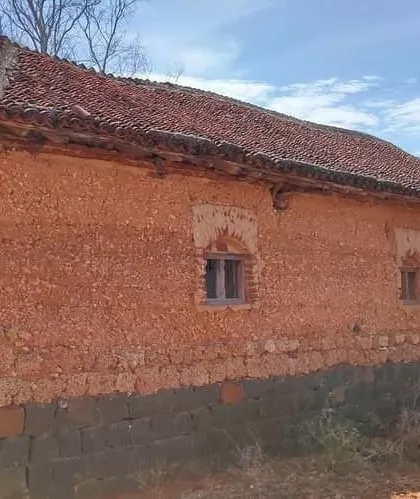A traditional mud house in a local village, which served as inspiration for our work. The weathered cob walls and Mangalore tile roof demonstrate the longevity and timeless appeal of these natural building techniques.