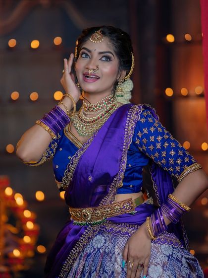 The sparkle of the jewellery is captured against the festive lights, showcasing the quality of our rental pieces.