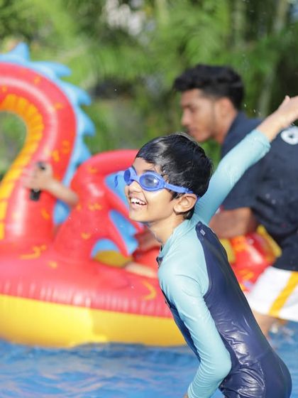 A candid shot of a child having a fantastic time in the pool. My goal is to create an environment where kids can just be kids and enjoy every moment.