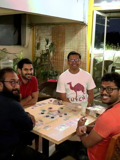 Another table enjoying a board game on the terrace. The combination of gaming, good food, and a great view is hard to beat.