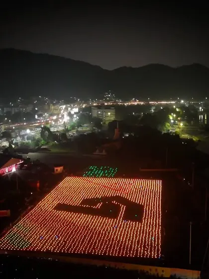 The largest aerial logo formation on the ground before takeoff in Vijayawada. This image shows the sheer scale of the 5500 drones required for our record-breaking performance.