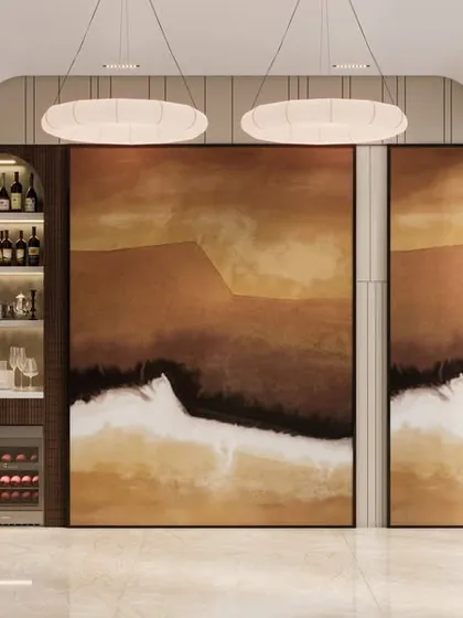 This view highlights the curated bar corner, which is seamlessly integrated with the living area. The design features a stunning art panel that conceals the bar, blending modern elegance with soulful comfort.