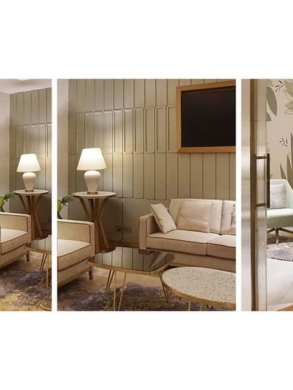 A view of the Private Lounge at the Bangalore airport, showcasing the custom fluted glass and metal partition. This detail creates a sense of separation and exclusivity for the more secluded seating area.