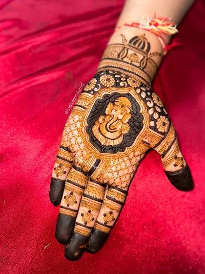 Ganpati Bappa Morya! A portrait of our beloved Ganesha to bring blessings and remove obstacles. This design uses negative space to make the portrait pop, surrounded by fine details for a truly divine look on Ganesh Chaturthi.