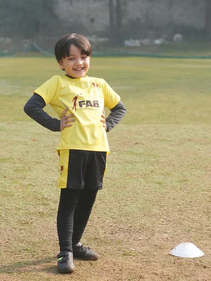 A smiling young player. Happiness and growth intertwine as our players embark on a journey of self-discovery and skill development.
