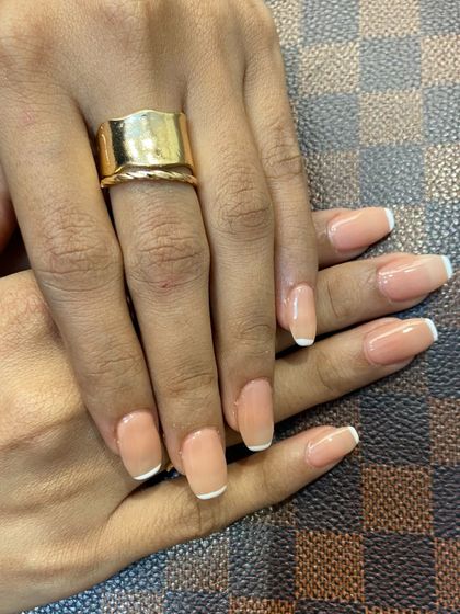The perfect accessory to any outfit. These classic French tips are versatile, chic, and always in style.