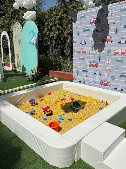 Our portable sandpit set up for an outdoor vehicle-themed birthday party. We provide clean sand and a variety of toys, offering a wonderful sensory play experience that can be placed in gardens or even indoors without any mess.