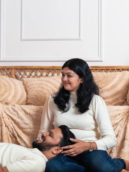 A playful moment on the floor during a family session. We encourage families to relax and interact naturally to capture the most authentic memories.