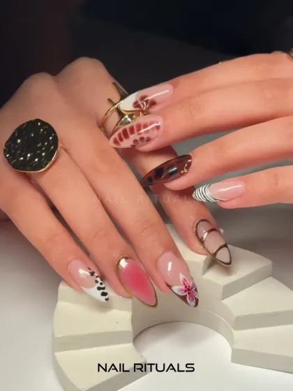 Art from every angle. This shot displays the full range of designs in this eclectic set, proving that your nails can be a canvas for self-expression.