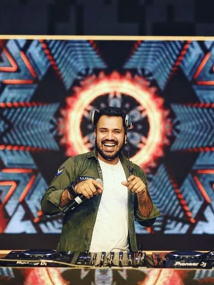 Here I am in front of a custom VJ setup, ready to drop the beats. A key part of my service is the full audio visual experience, where I mix music videos live to create an immersive show that goes beyond just sound.