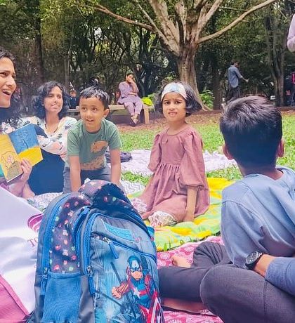 A series of photos from our 'Courage' themed session, showing different angles of the group and the beautiful, leafy surroundings of our storytelling spot.