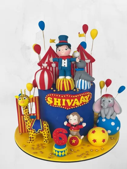 Welcome to the circus! This vibrant cake for Shivaay's 6th birthday is a spectacle of fun, with a ringmaster, circus animals, and bright, cheerful colors.