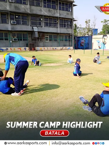 A coach guides students through stretching exercises. Proper warm-ups and cool-downs are an important part of our injury prevention strategy.