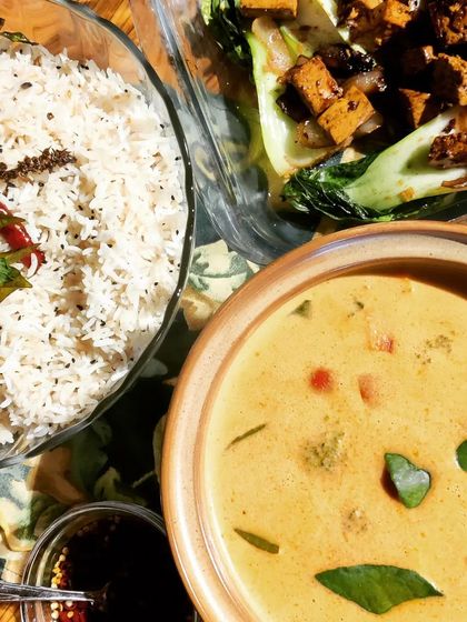 A complete Thai meal featuring our homemade vegetarian Red Curry, served with fragrant Thai Basil Rice and a side of Bok Choy with Black Bean Tofu.