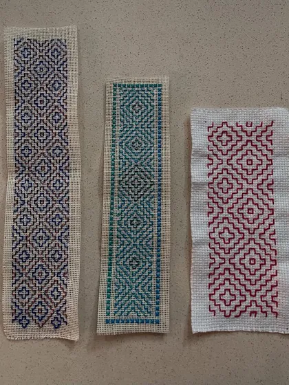 Three Kasuti samplers showing different colorways and patterns. I offer group sessions where you can learn this meditative art from an expert.