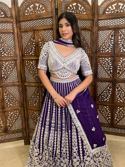 A closer look at the model in the purple and silver lehenga, showing the beautiful choker-style dupatta and the detailed blouse.