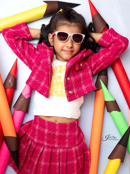Relaxing in a sea of colors. This laid-back pose shows a different side of the birthday girl's personality during her fun-filled shoot.