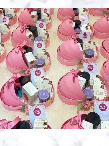 Pretty in pink! Here's a look at a full order of our custom "It's a Girl!" cradle announcement hampers, ready to be delivered.
