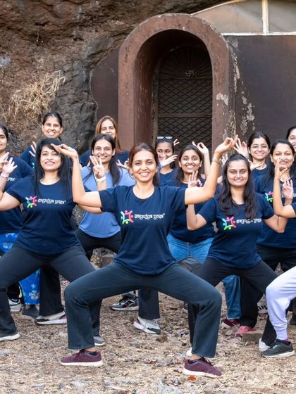 Our retreat participants embodying the energy of the divine feminine in Devi Asana. Practicing in nature amplifies the power and joy of the asana.