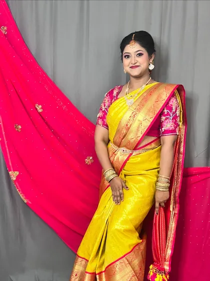 A complete traditional look, from the makeup and hair to the beautiful saree. Perfect for any South Indian wedding or family function.