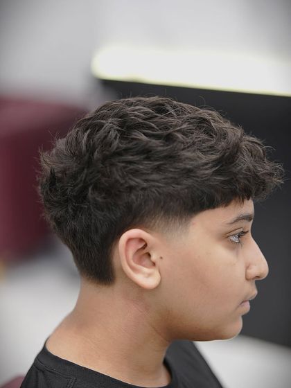 Another angle of the taper fade, showing the clean lines around the ear.