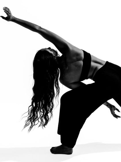 A dramatic backbend, showcasing flexibility and strength. This high-impact image is a testament to the physicality of dance.