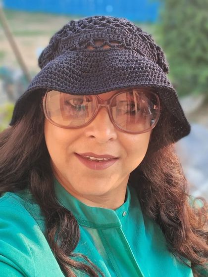 Another angle of the versatile black crochet bucket hat, a perfect accessory for sun protection with a fashionable, artisanal touch.