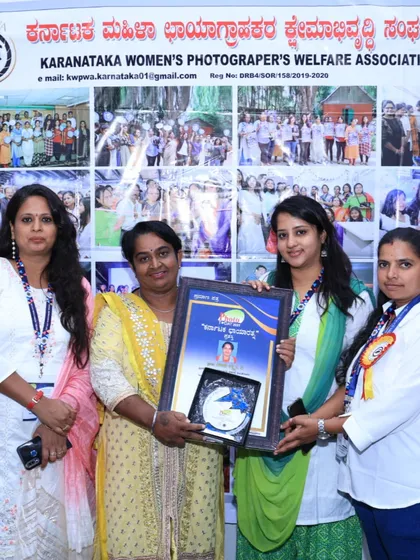 Receiving the award from the Karnataka Women's Photographer's Welfare Association. It's an honor to be recognized by my peers.