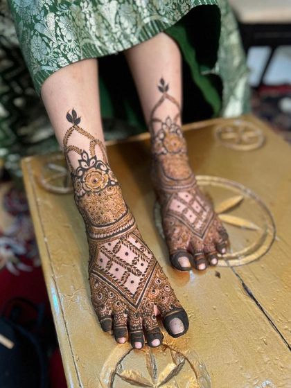 An angled view of the bridal foot henna.
