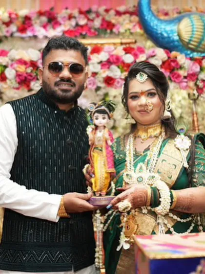 "Kuni yenar ga?" (Who is coming?). A beautiful portrait of a couple holding the Krishna doll from our gender reveal set.