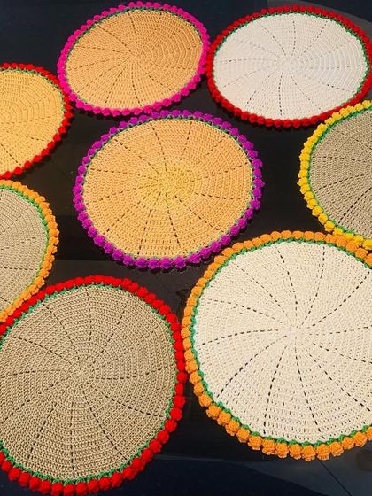 An assortment of my tulip-edged doilies in various color combinations. This shows how you can mix and match to create a vibrant and eclectic set.