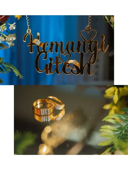 Personalised details make your day unique. Here, I've captured the couple's engagement rings alongside a custom nameplate, creating a special memory of their celebration.
