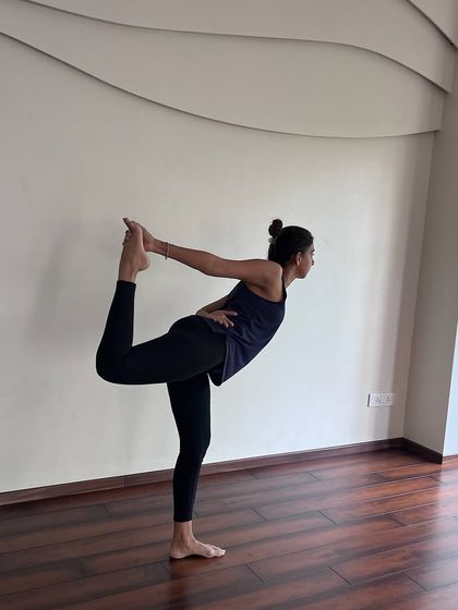 Channeling the cosmic dance of life in this variation of Natarajasana (Dancer's Pose), which speaks to the fluidity of strength.