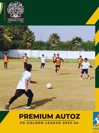 A young player takes a shot on goal during a competitive match in the Golden League.