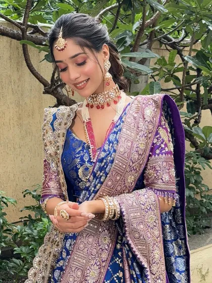 A happy, smiling shot of the model in her grand outfit, looking ready for a celebration.