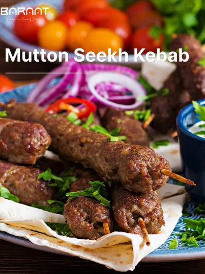 A platter of my succulent Mutton Seekh Kebabs, served with fresh onions and mint chutney. They are grilled to perfection and are a treat for the senses.