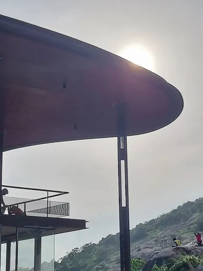 The curved roof of Villa Soham was designed to echo the lines of the surrounding landscape. As the sun sets, its form creates a powerful silhouette against the sky, a quiet dialogue between the built and the natural.