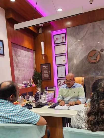 A couple seeking guidance in my office. I offer joint counseling sessions to help partners understand each other better through the lens of numerology and counseling.