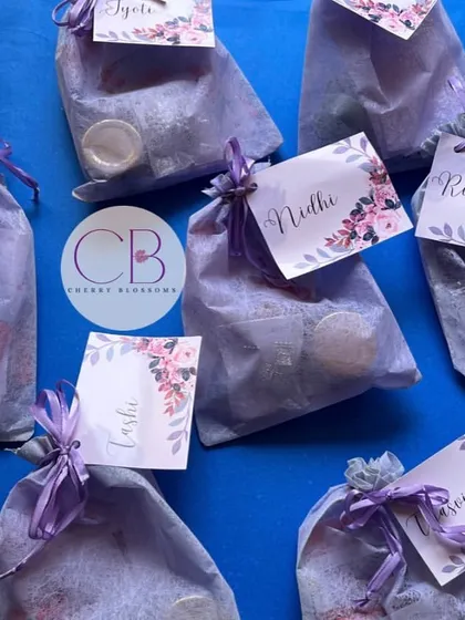 Our budget-friendly bridesmaid favours, beautifully wrapped in purple organza bags. Each bag is personalised with a floral name tag for that extra special touch.