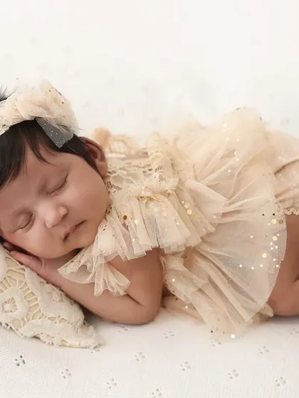Sleeping soundly. Another beautiful angle from our "Hello World" session, this image captures the peacefulness of a newborn in a classic, simple setting.