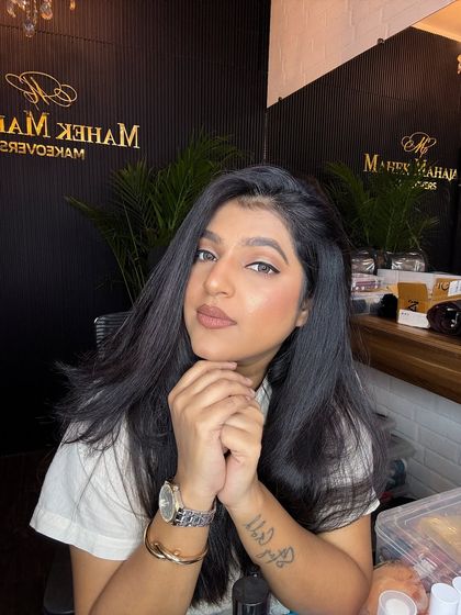 A close-up of the simple party makeup, showing the soft brown eyeshadow and nude lip.