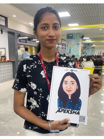 A guest at the Goregaon IT park with her full-colour digital caricature. This modern approach is perfect for corporate events and tech-savvy audiences.