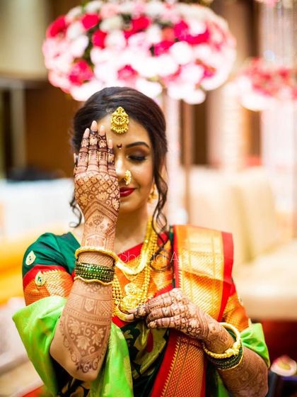 The true beauty of a bride lies in the henna on her hands. A classic pose from my bride Niyati, showcasing her elegant back-hand mehendi design.