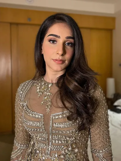 A perfect close-up of Nishtha's makeup. The focus is on her bold brows and winged eyeliner, creating a powerful and confident look.