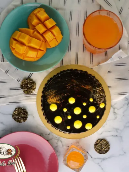 The Chocolate Mango Cake offers a rich combination of tropical sweetness and deep chocolate flavor.