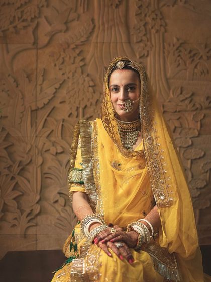 A portrait of the Rajput bride. Her traditional attire and minimal makeup create a look of royal, understated elegance.